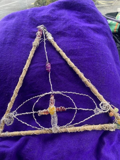 Triangle of wands with eye of Horus